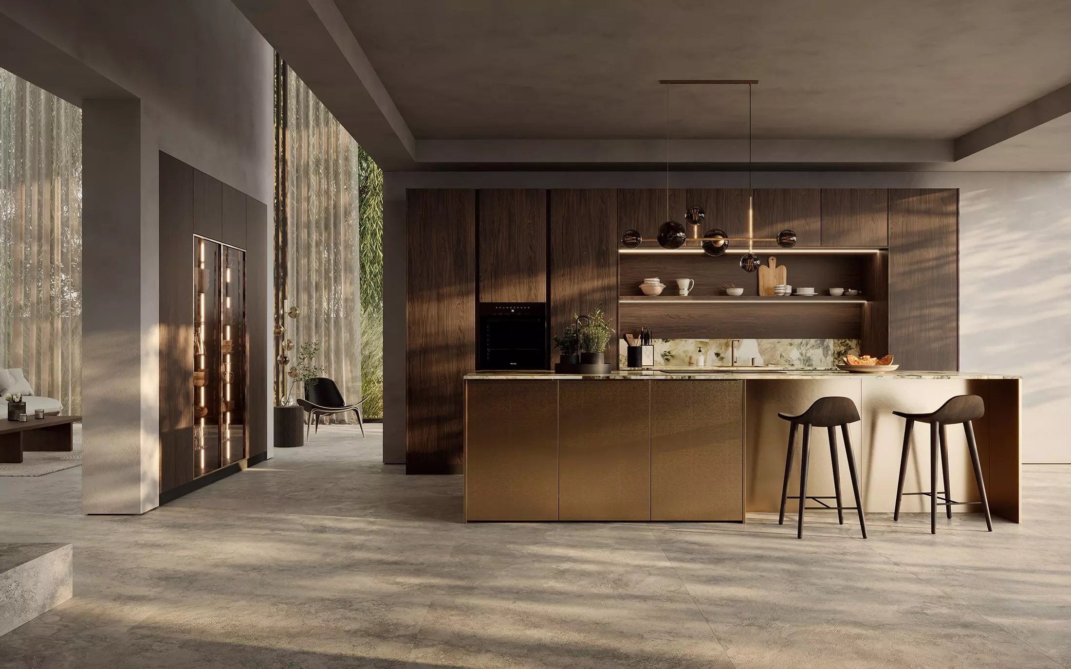 Grande cuisine Rotpunkt avec îlot bronze, façades bois foncé, plan de travail effet marbre et espace bar intégré.