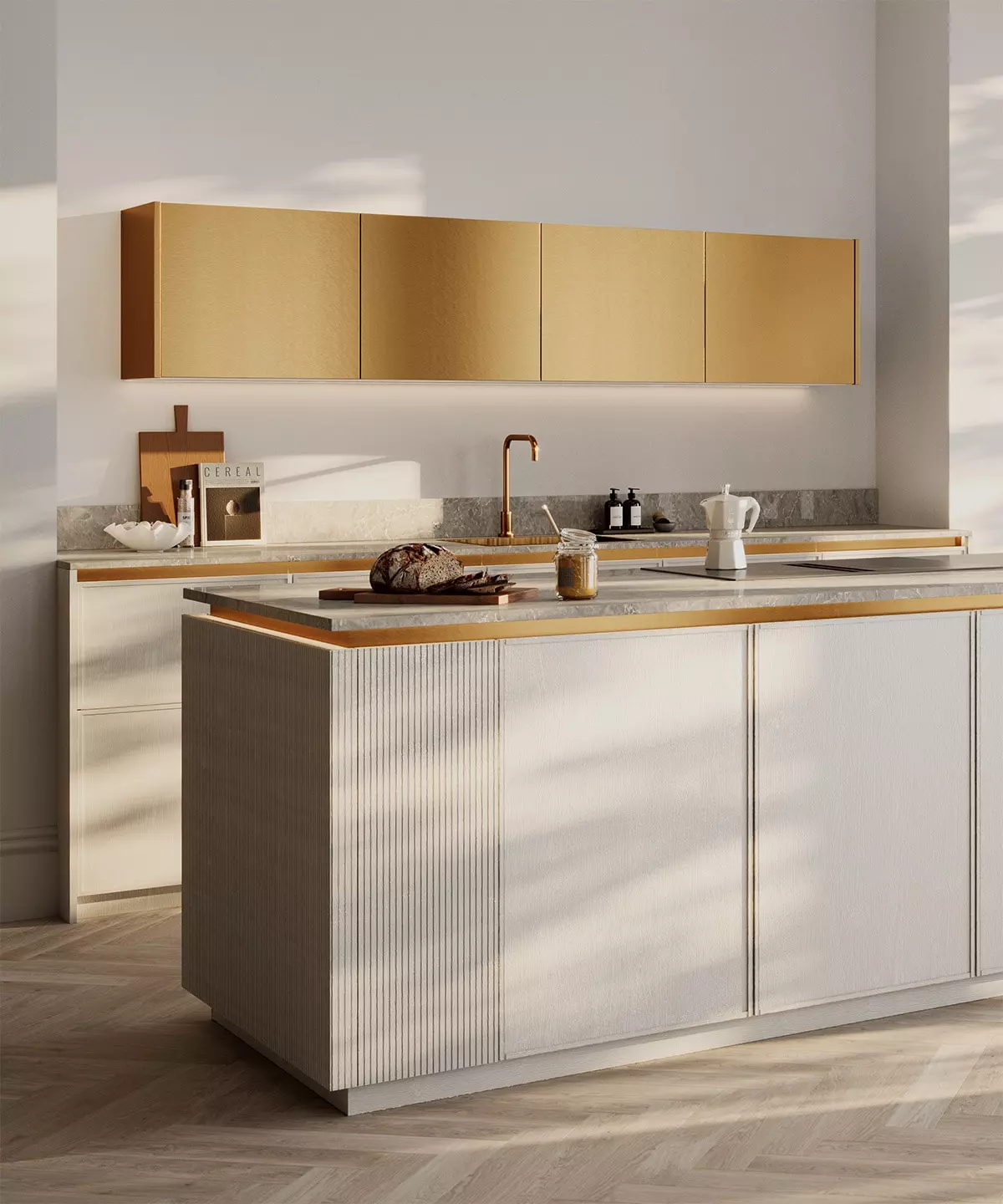 Cuisine design Rotpunkt avec îlot blanc texturé, meubles hauts dorés, robinet cuivré et plan de travail minéral.