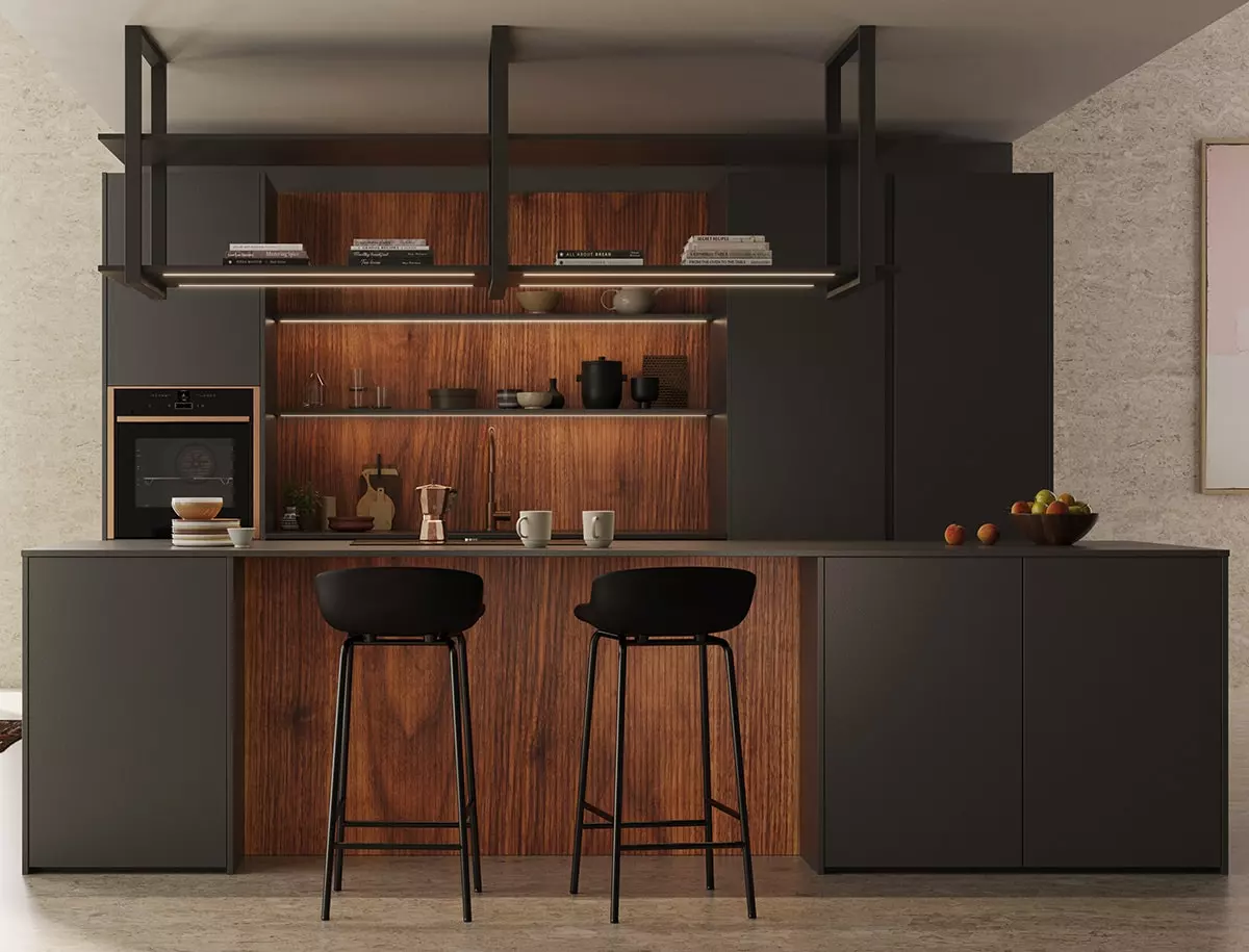 Îlot central d'une cuisine Rotpunkt avec façades minérales sombres, espace repas, tabourets hauts.